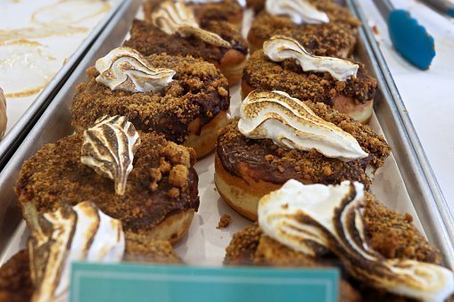 Donuts with chocolate frosting and a toasted meringue topping 