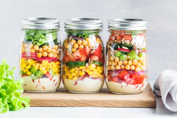 salads in three different jars and a variety of flavors
