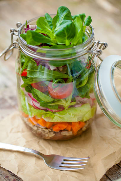 salad in glass mason jar